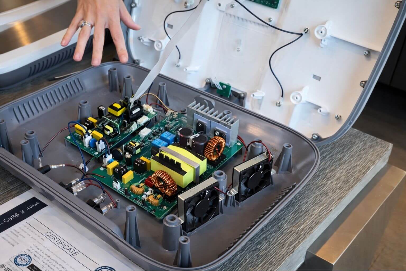 Inside OlyLife P90 device showing internal components and electronics layout